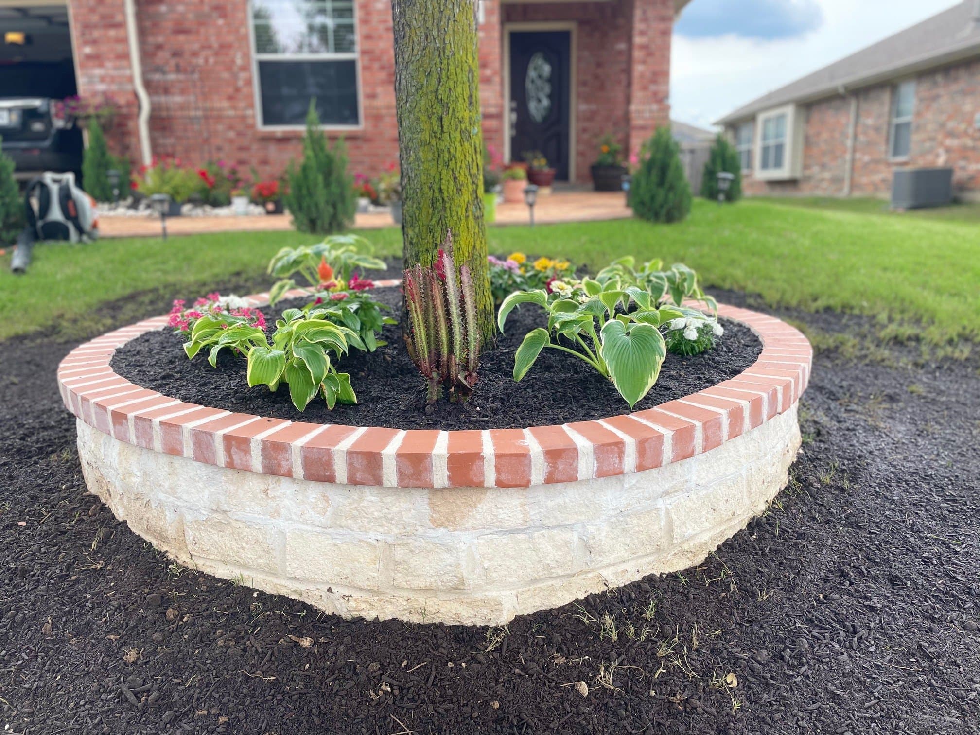 Circular brick planter and fresh bed install